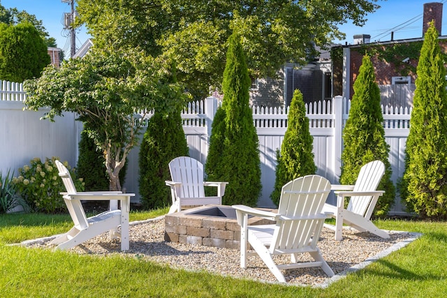 view of yard with a fire pit