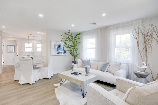 living room with light hardwood / wood-style flooring