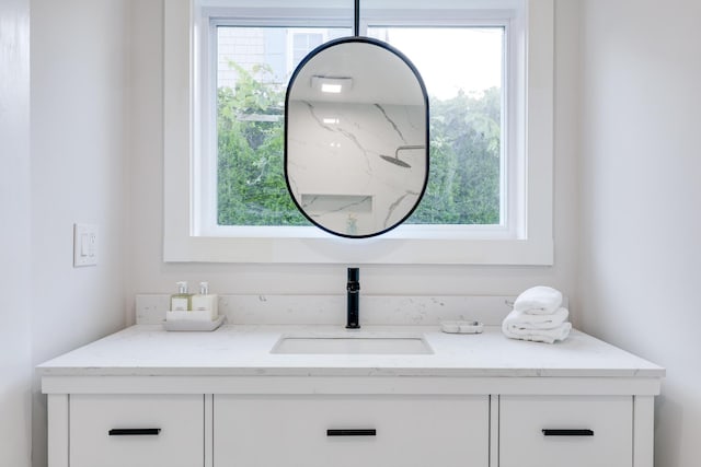 bathroom with vanity and plenty of natural light