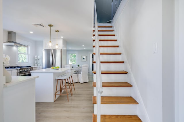 staircase featuring hardwood / wood-style flooring