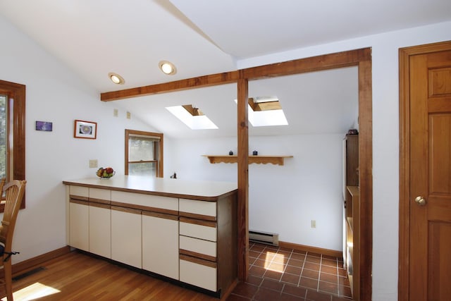 21 High Point Dr, Brewster, MA 02631 - bar featuring a skylight, a baseboard radiator, and baseboards
