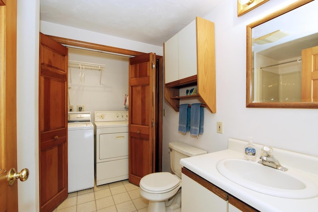 21 High Point Dr, Brewster, MA 02631 - bathroom with washing machine and clothes dryer, vanity, toilet, a shower, and tile patterned floors