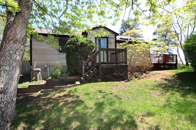 21 High Point Dr, Brewster, MA 02631 - back of house featuring a lawn and a wooden deck