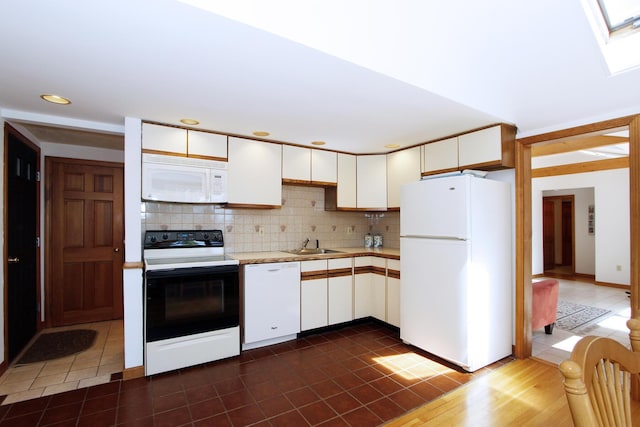 21 High Point Dr, Brewster, MA 02631 - kitchen featuring white appliances, a sink, light countertops, tasteful backsplash, and white cabinetry