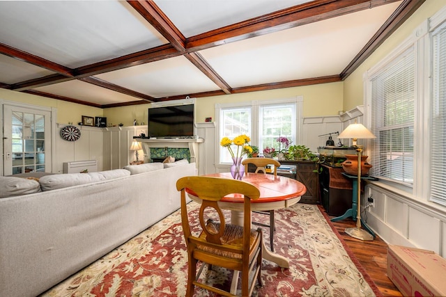 living room featuring wood-type flooring, coffered ceiling, and beam ceiling