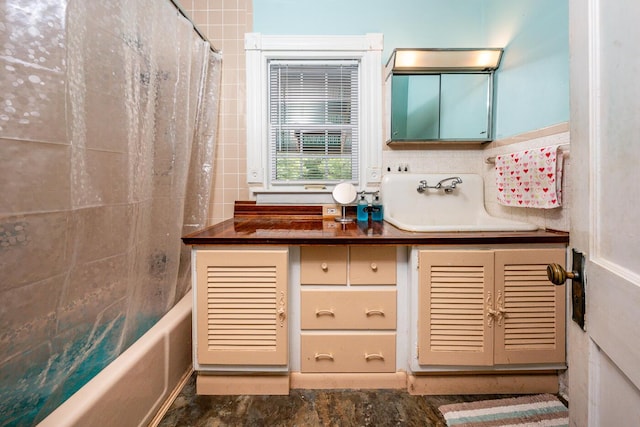 bathroom with vanity and shower / bath combination with curtain