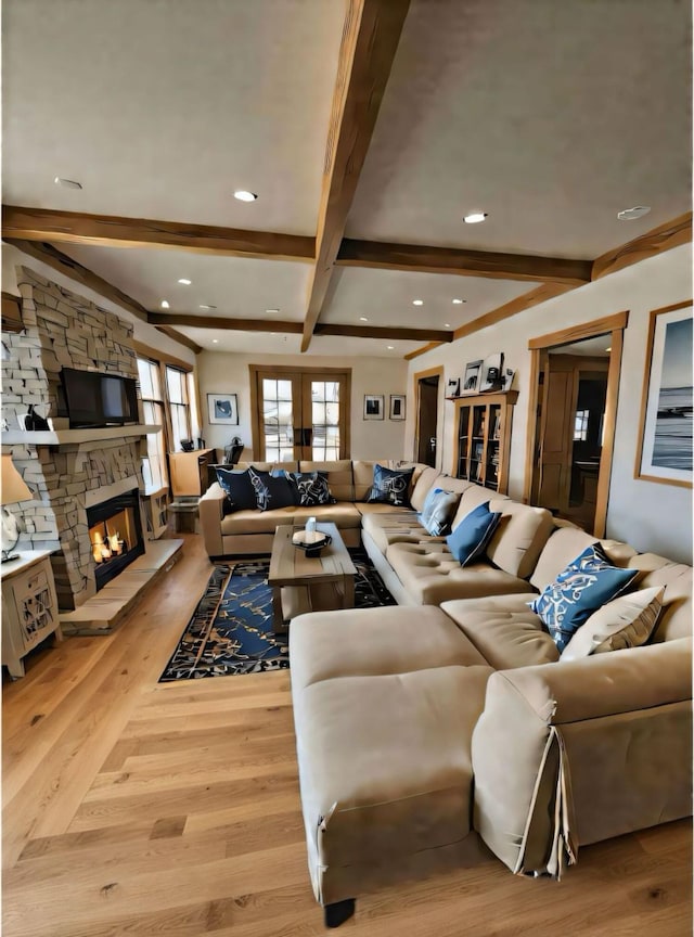 159 Pleasant Lake Ave, Harwich, MA 02645 - living area featuring beamed ceiling, light wood-style flooring, a stone fireplace, and recessed lighting