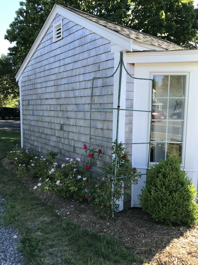 view of side of home with an outdoor structure