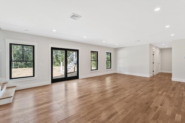 unfurnished living room featuring light hardwood / wood-style floors