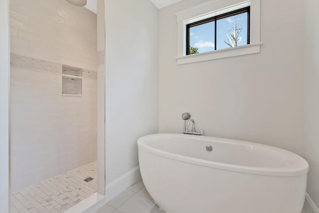 bathroom featuring independent shower and bath and tile patterned flooring