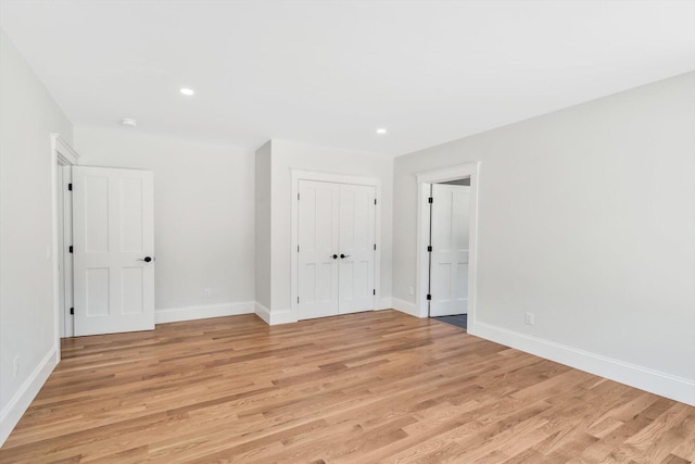 spare room featuring light hardwood / wood-style flooring