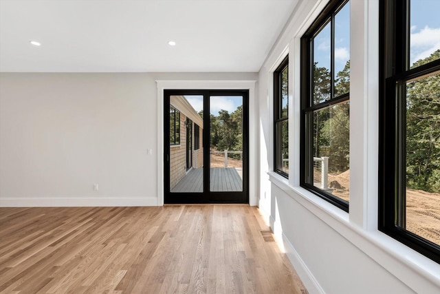 doorway to outside with light hardwood / wood-style flooring