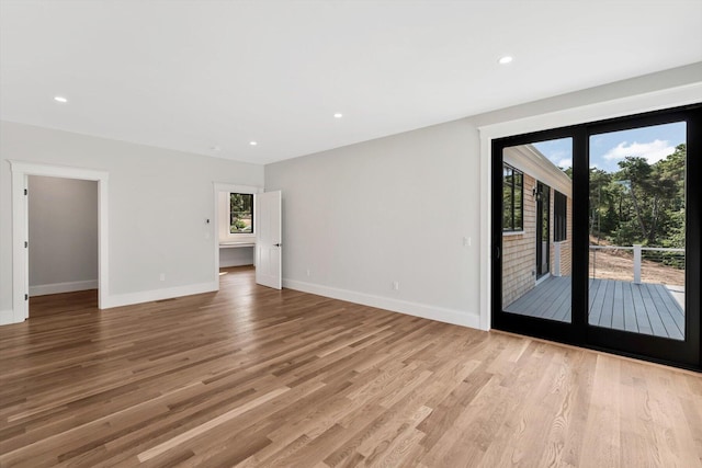 unfurnished room featuring light hardwood / wood-style flooring