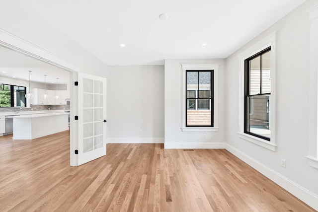 unfurnished living room featuring light hardwood / wood-style flooring