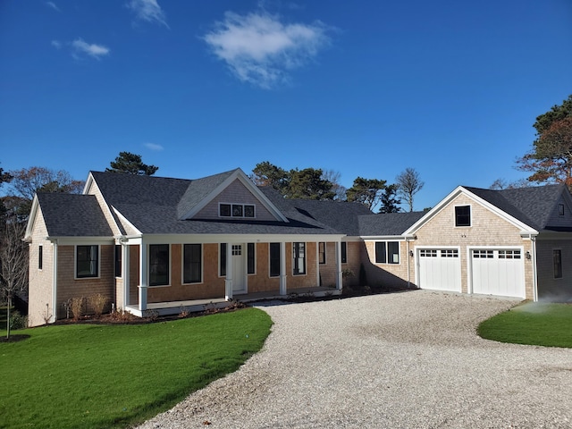 view of front of home with a garage and a front yard