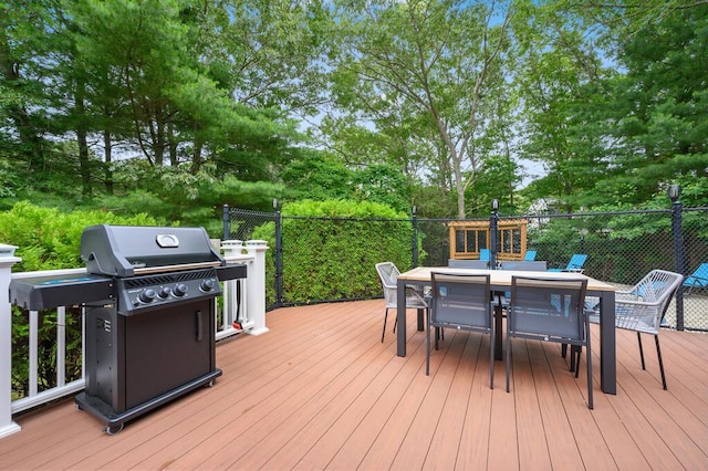 wooden terrace featuring grilling area