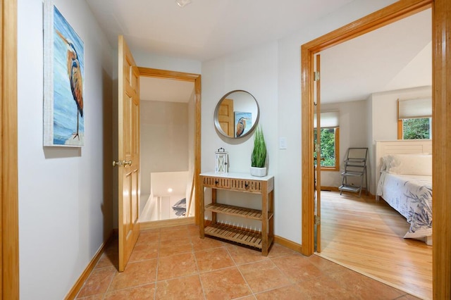 corridor featuring light tile patterned floors