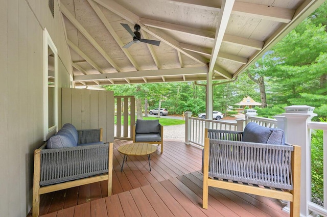 wooden terrace featuring ceiling fan