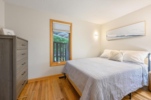 bedroom with light hardwood / wood-style flooring