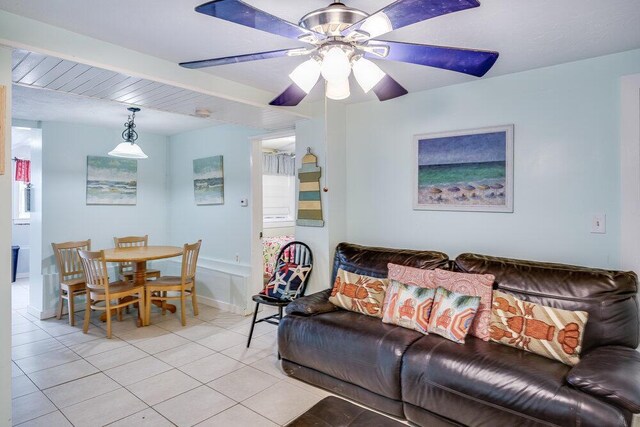 281 Gosnold St, Hyannis, MA 02601 - living room featuring light tile patterned floors, ceiling fan, and baseboards