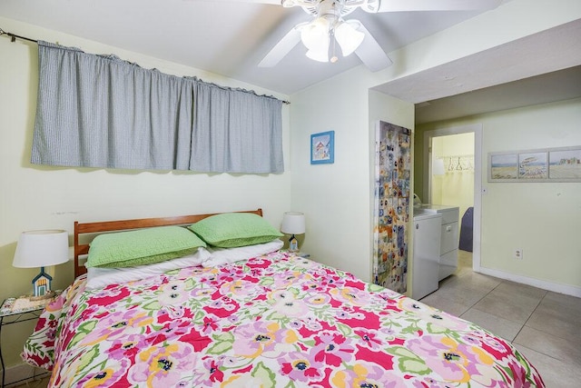 281 Gosnold St, Hyannis, MA 02601 - tiled bedroom featuring washing machine and clothes dryer, vaulted ceiling, a ceiling fan, baseboards, and ensuite bathroom