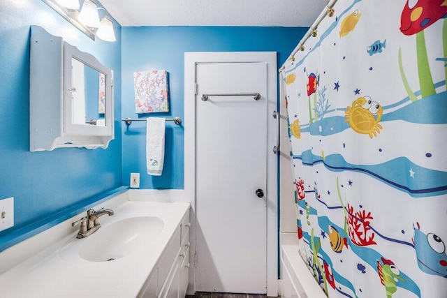 281 Gosnold St, Hyannis, MA 02601 - full bathroom with vanity and shower / bath combo with shower curtain