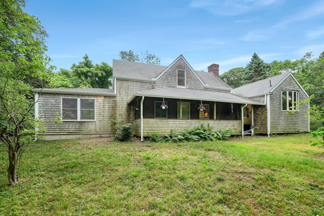 174 Middle Rd, Chilmark, MA 02535 - back of house featuring a yard, a chimney, a sunroom, and a shingled roof