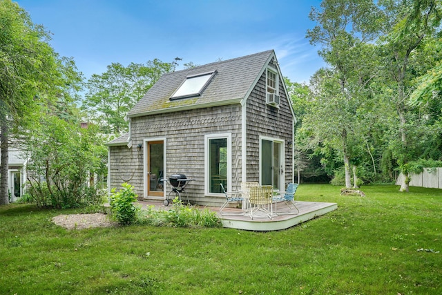 174 Middle Rd, Chilmark, MA 02535 - rear view of property with a deck, a yard, a shingled roof, and cooling unit