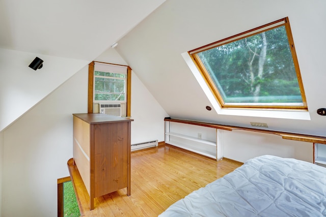 174 Middle Rd, Chilmark, MA 02535 - bedroom featuring baseboard heating, cooling unit, light wood finished floors, vaulted ceiling, and a skylight