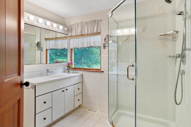 174 Middle Rd, Chilmark, MA 02535 - bathroom with vanity, a stall shower, tile walls, and tile patterned flooring