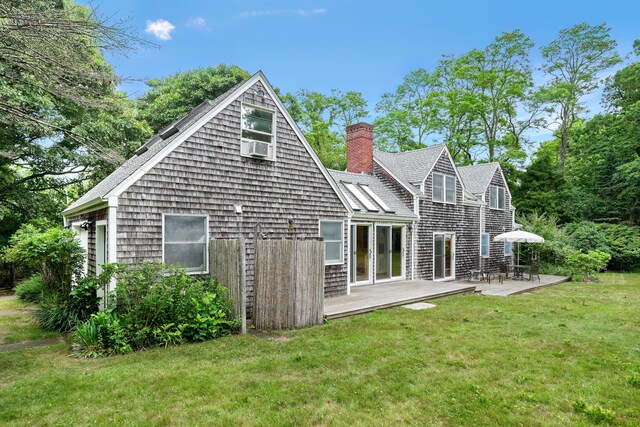 174 Middle Rd, Chilmark, MA 02535 - back of property with a yard, a chimney, a patio, and roof with shingles