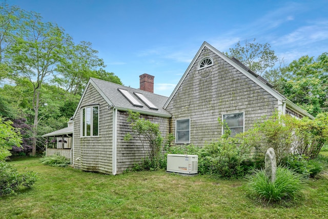 174 Middle Rd, Chilmark, MA 02535 - view of home's exterior with a chimney, a lawn, and a shingled roof
