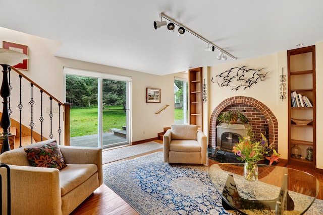 174 Middle Rd, Chilmark, MA 02535 - living room with wood finished floors, rail lighting, and built in features