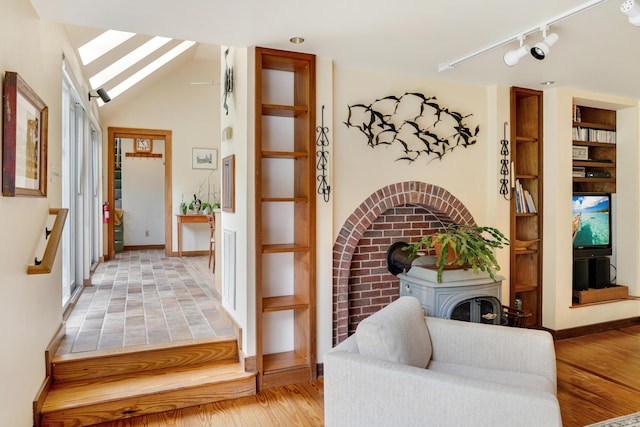 174 Middle Rd, Chilmark, MA 02535 - entryway featuring track lighting, light wood-style floors, and a wood stove