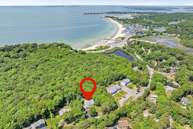 aerial view featuring a water view and a view of trees