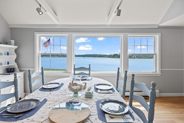 45 Seth Ln, South Yarmouth, MA 02664 - dining area with track lighting, wood-type flooring, baseboard heating, and a water view