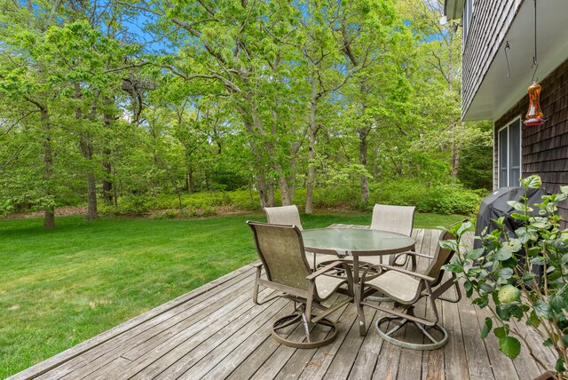 5 Bayes Hill Cir, Oak Bluffs, MA 02557 - deck with outdoor dining area, a yard, and a grill