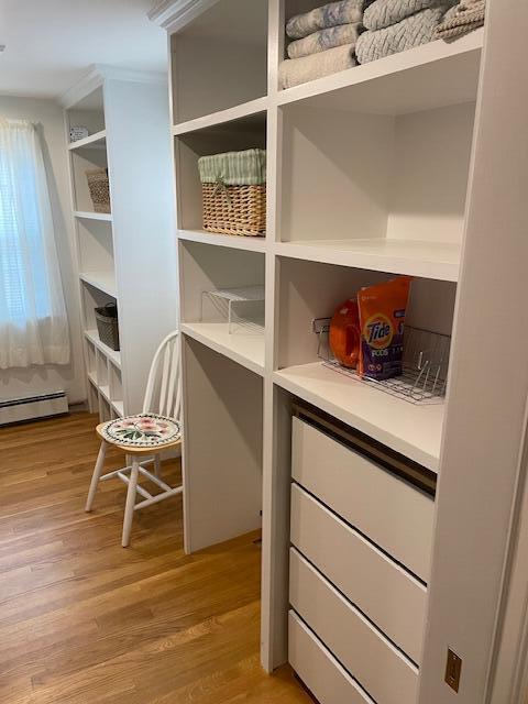 pantry featuring a baseboard radiator