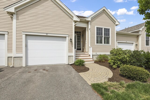 21 Grey Hawk Dr, Mashpee, MA 02649 - ranch-style house featuring driveway and an attached garage