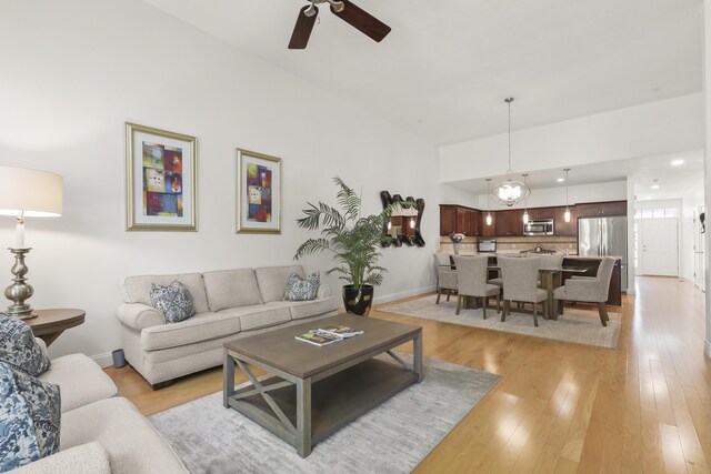 21 Grey Hawk Dr, Mashpee, MA 02649 - living area featuring a ceiling fan, baseboards, and light wood-style flooring