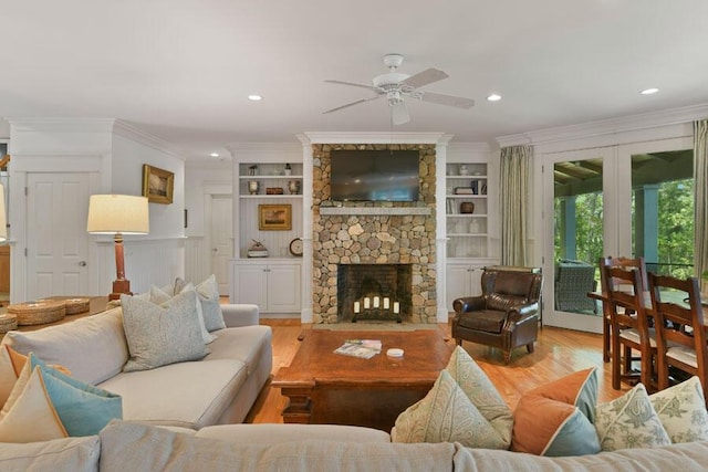 14 Indian Trl, Osterville, MA 02655 - living area featuring a ceiling fan, wood finished floors, french doors, ornamental molding, and a fireplace
