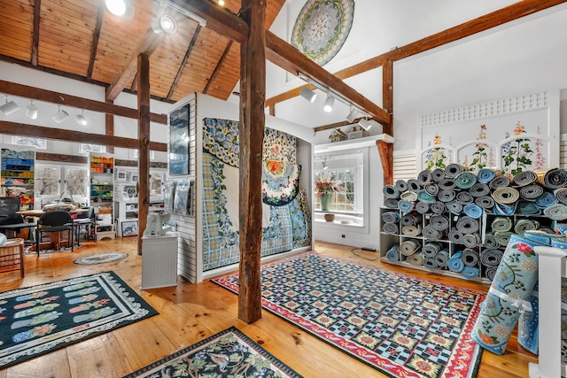 foyer entrance featuring beam ceiling, wood-type flooring, high vaulted ceiling, and wood ceiling