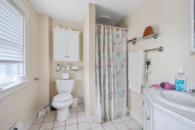 bathroom featuring a baseboard radiator, vanity, tile patterned floors, and toilet