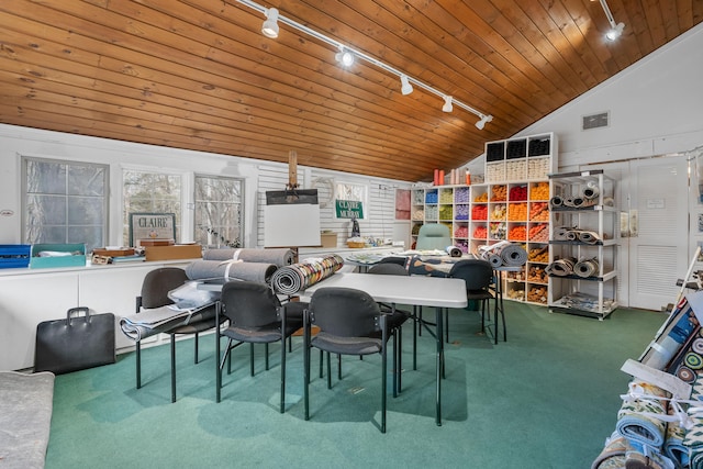 dining space featuring wood ceiling, carpet flooring, high vaulted ceiling, and rail lighting