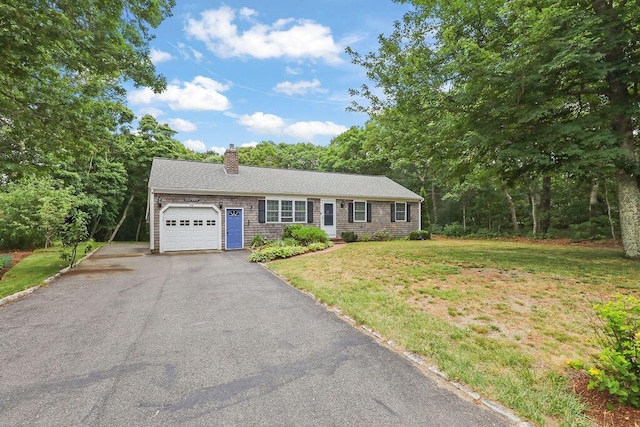 196 Commons Way, Brewster, MA 02631 - single story home with a garage, asphalt driveway, a chimney, and a front yard