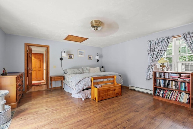 196 Commons Way, Brewster, MA 02631 - bedroom with baseboard heating, light wood-style flooring, and ceiling fan