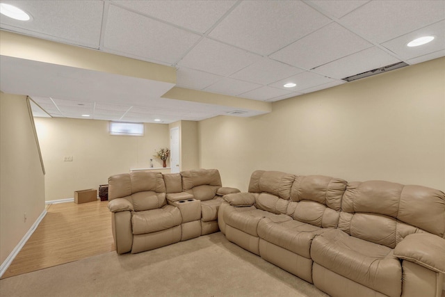 living room with a drop ceiling