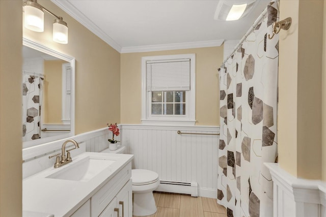 bathroom with crown molding, toilet, a baseboard heating unit, and vanity