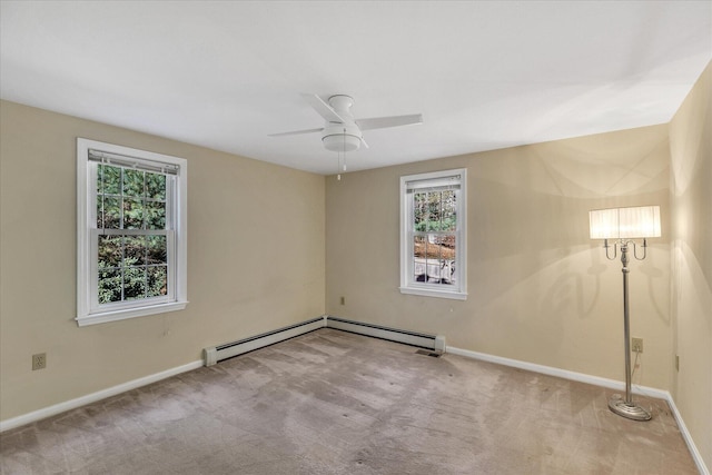 empty room with light carpet, ceiling fan, and a baseboard heating unit