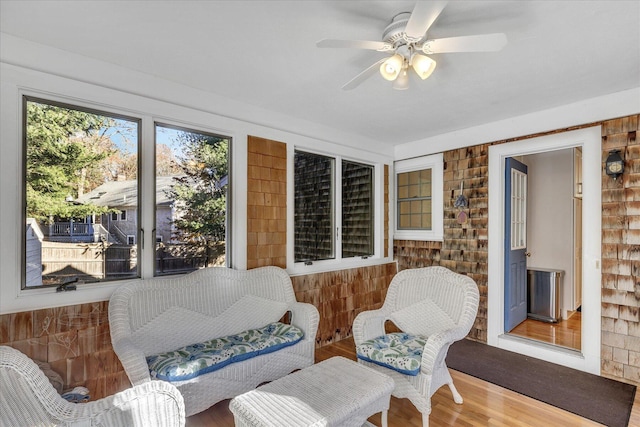 sunroom / solarium with ceiling fan